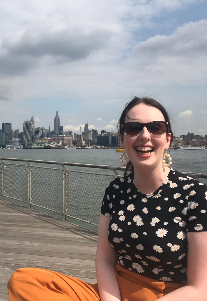 A picture of Hazel O'Rourke with the NYC skyline in the background